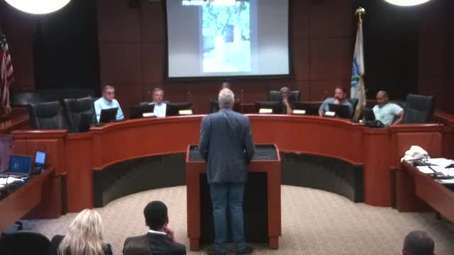 Neighbors clash over controversial garage construction permit