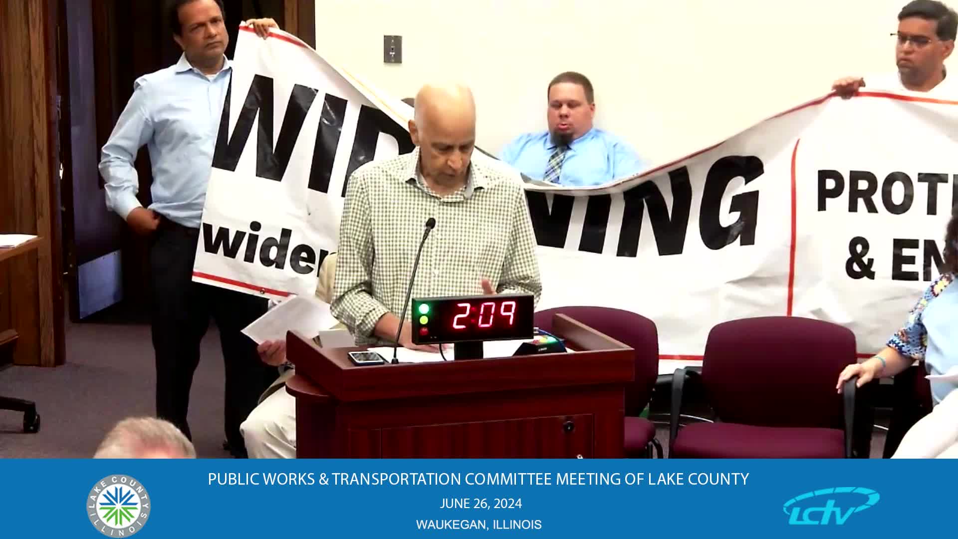 Residents rally against costly road widening project