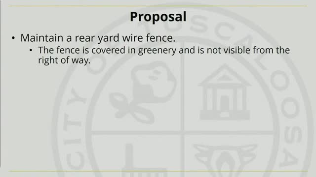 Controversial fence sparks debate in historic neighborhood