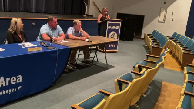Parents rally against controversial wrestling coach decision
