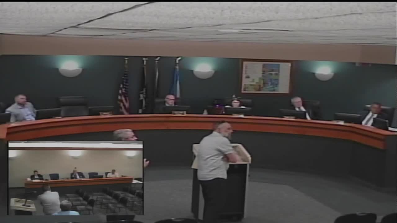 City debates fate of parking lot amid redevelopment plans