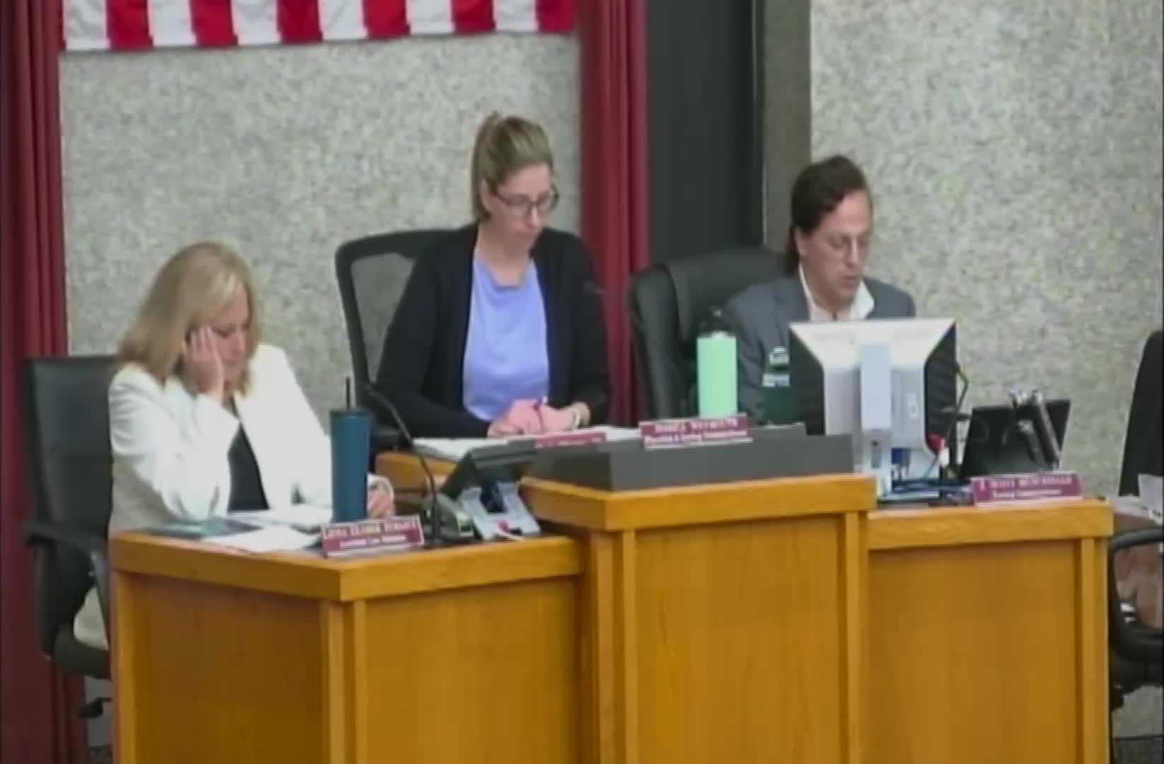 Security Gate Controversy Sparks Heated Commission Debate