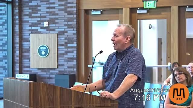 Residents rally against controversial housing development plan