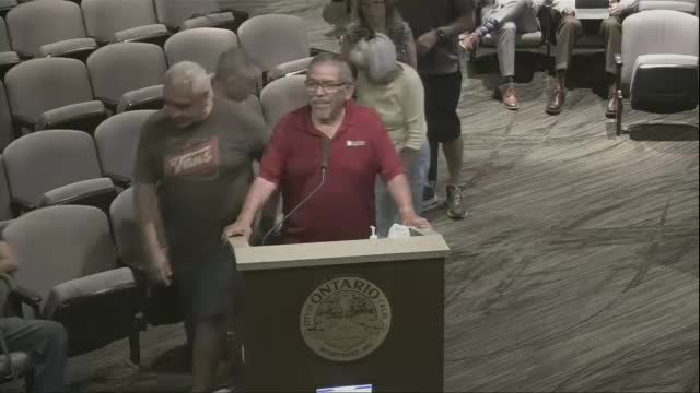 Residents rally against controversial housing development plan