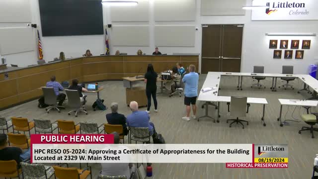 City officials clash over building color choice debate