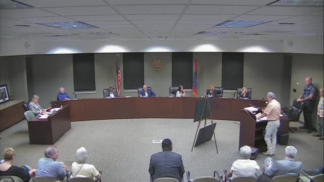 Residents rally against controversial housing development plan