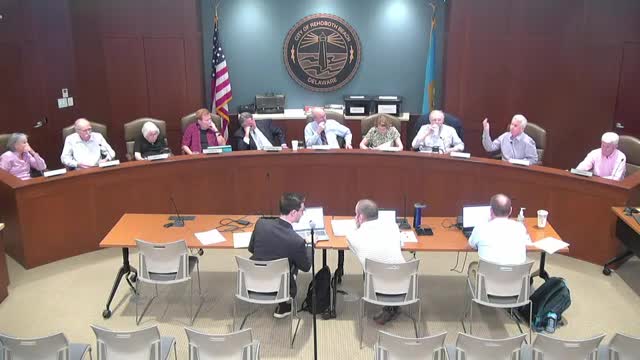 Building inspector defends controversial antenna installation plan