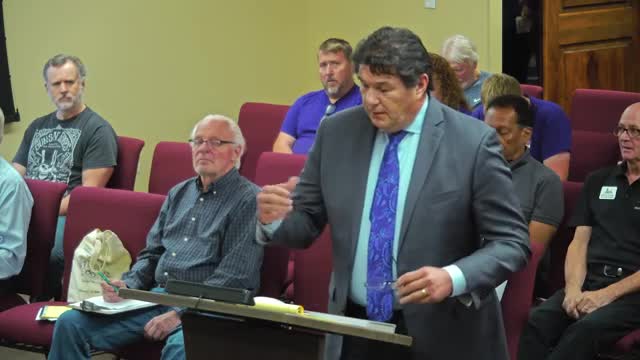 Council debates controversial development plan amid community concerns