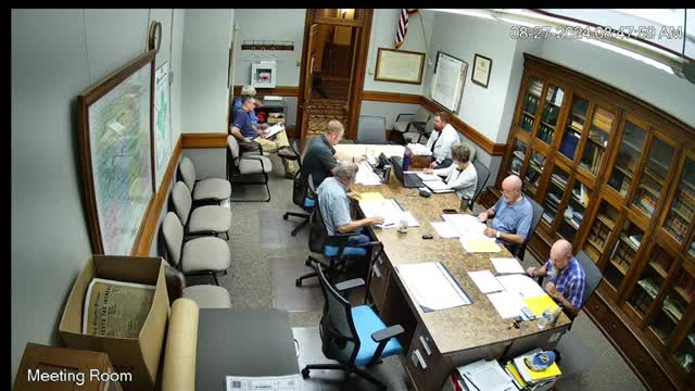 County attorney agreement sparks debate over payment terms