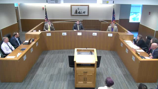 Commissioner confronts conspiracy claims in heated debate
