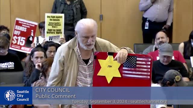 Activists rally to defend Seattle's minimum wage victory