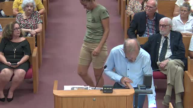 Residents rally against controversial golf course development plan