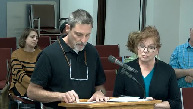 Neighbors rally for fence to block junkyard eyesore