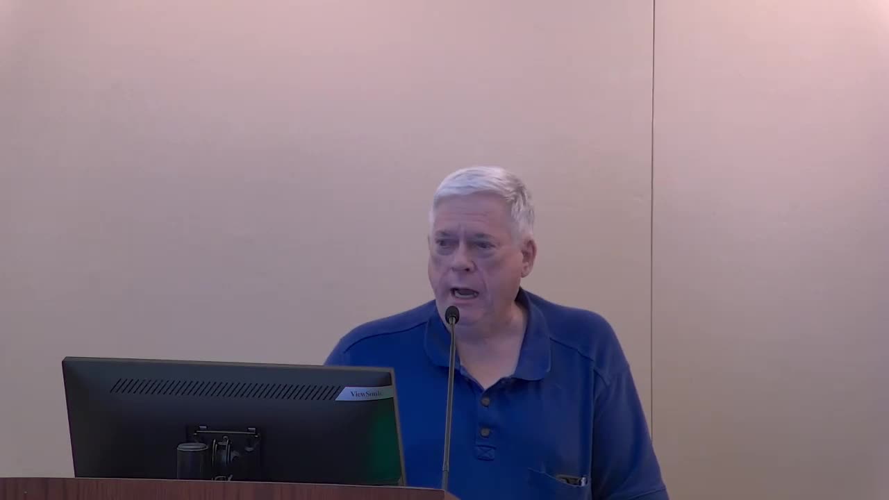 Residents rally against controversial housing development plan