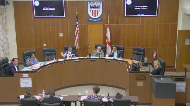 City debates parking fees amid revitalization concerns