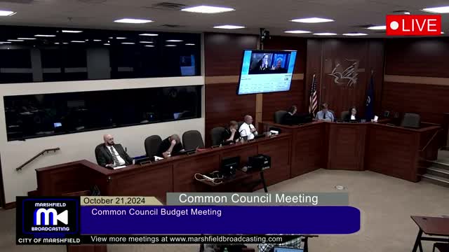 Budget Meeting Sparks Controversy Over Employee Wage Cuts