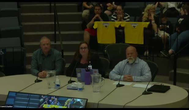 School Board Debates Electric Bus Funding Amid Budget Cuts