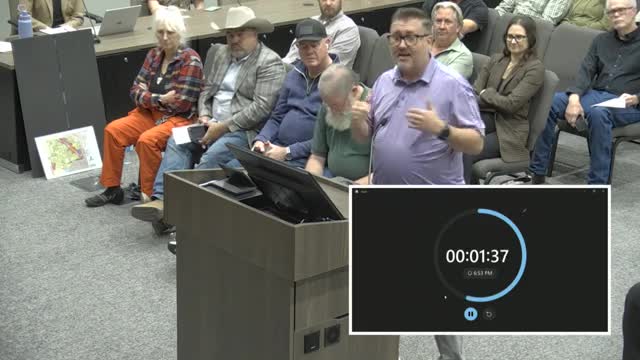 Residents rally against controversial mixed-use development plan