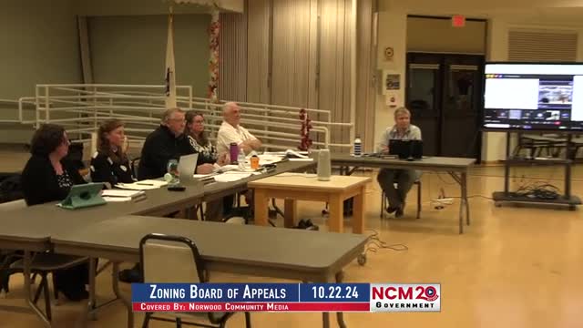 Community rallies against controversial parking lot proposal