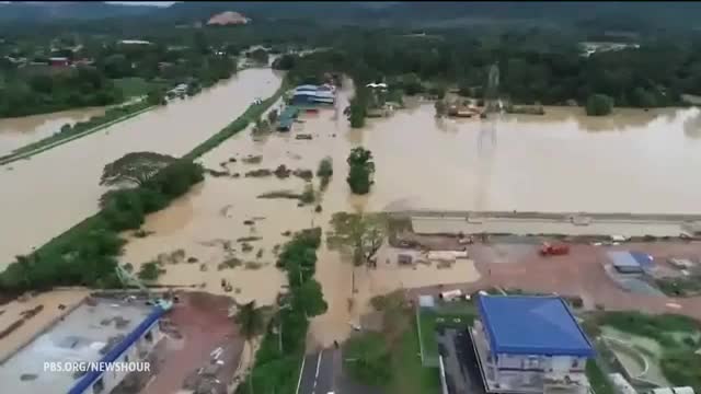 Severe flooding and freezing temperatures threaten millions
