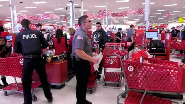 Local police and volunteers bring holiday cheer to 45 kids through Shop with a Cop event