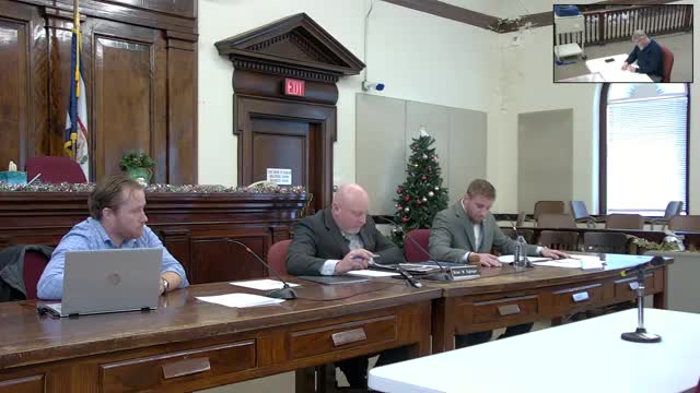 Commissioners debate using opioid-settlement funds for school activity buses; decision deferred to next meeting