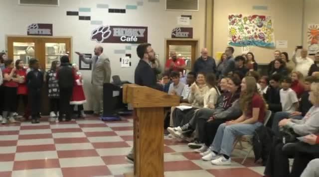 Board recognizes state-champion marching band and grants tenure to district educators