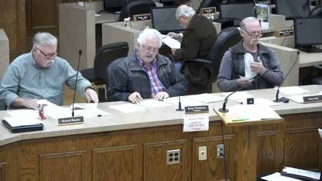 Board denies large setback variances for lakefront lot citing floodplain and precedent concerns