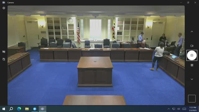 Staff review AV procedures for remote witnesses, microphones and lower-thirds before committee sessions