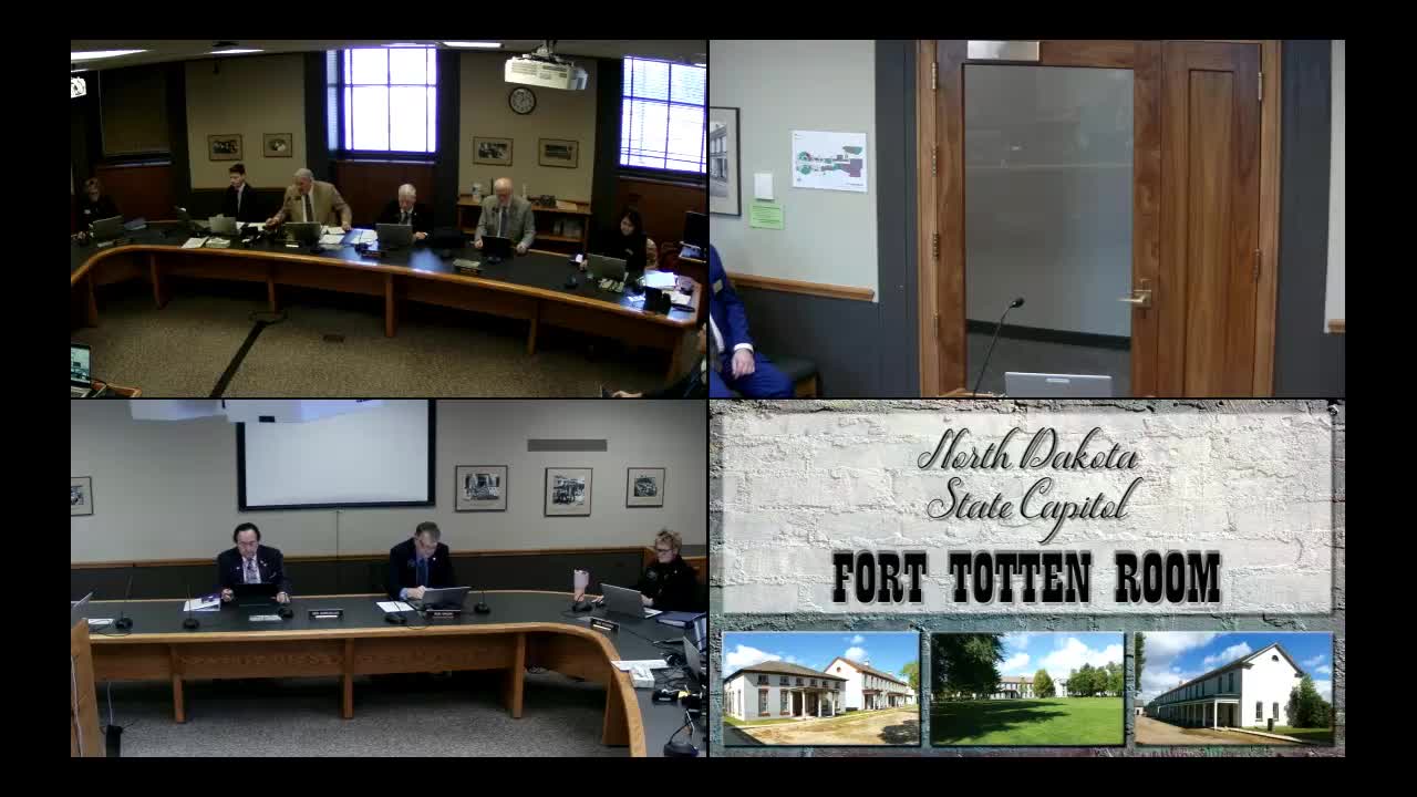 Finance and Taxation panel rejects amendment to cap school-dissolution transfers at $50,000; committee recommends 'do not pass' on SB2158