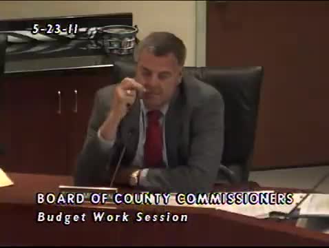 Commissioners approve one‑time $500 county employee stipend and defer major borrowing; CIP adjusted