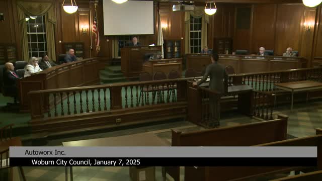 Residents and councilors oppose Auto Works spray booth near homes and school; council seeks legal advice and continues hearing