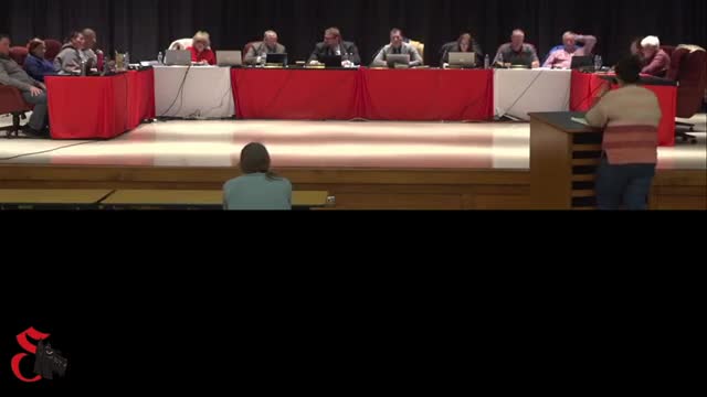 Board member urges transparency in hiring practices during meeting
