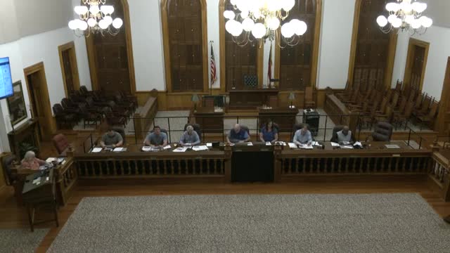 Commission tables poultry and pet‑parrot rezoning after neighbor concerns over noise, lighting and setback compliance