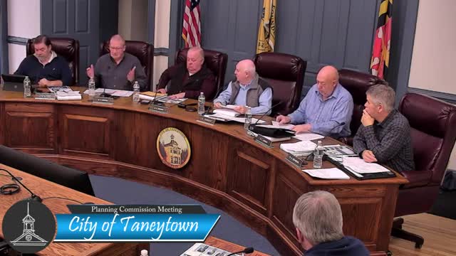 Commission debates community‑village overlay, townhouses and service capacity