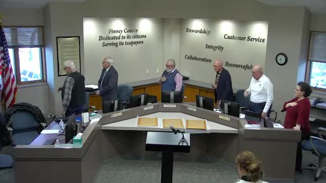 Senator Elect Bill Clifford honors retiring Finney County Commissioners at meeting