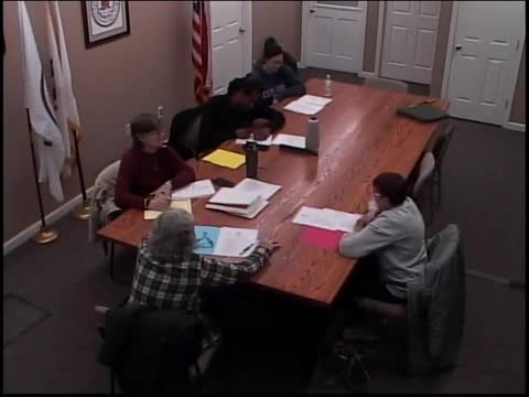 Board reappoints sanitarian and inspectors; food inspector abstains from vote