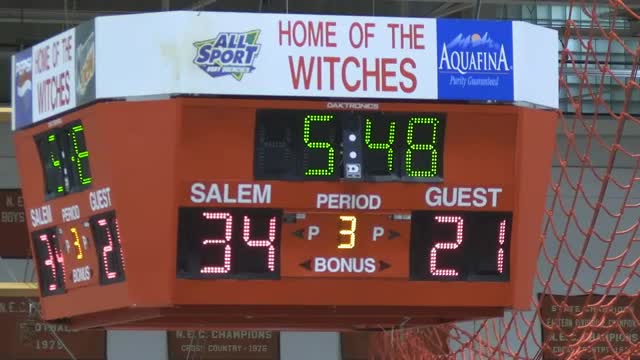 Salem High School Witches lead against North Reading in competitive basketball game