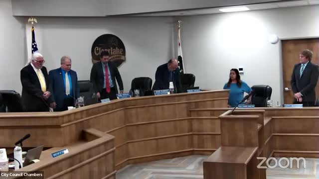 Police chief presents adoptable dog Roman at council meeting