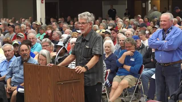 Community member pushes board to expand volunteer roles and clarify voting rights