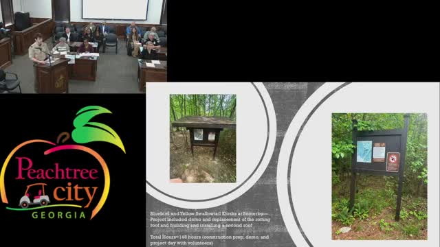 Volunteers renovate kiosks along Yellow Swallow Trail in community project