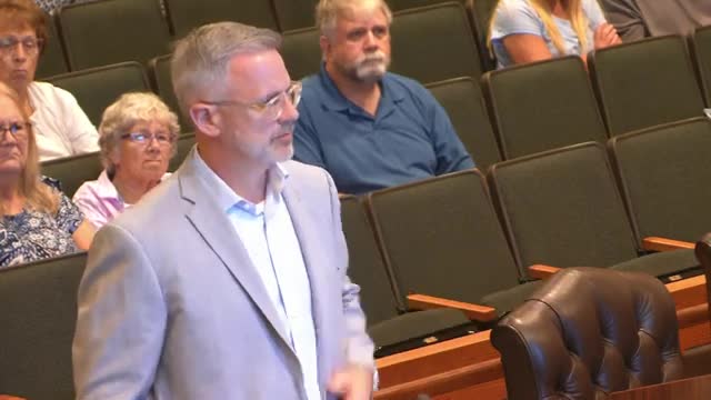 Developer agrees to height reduction and traffic restrictions for apartment complex near US 41