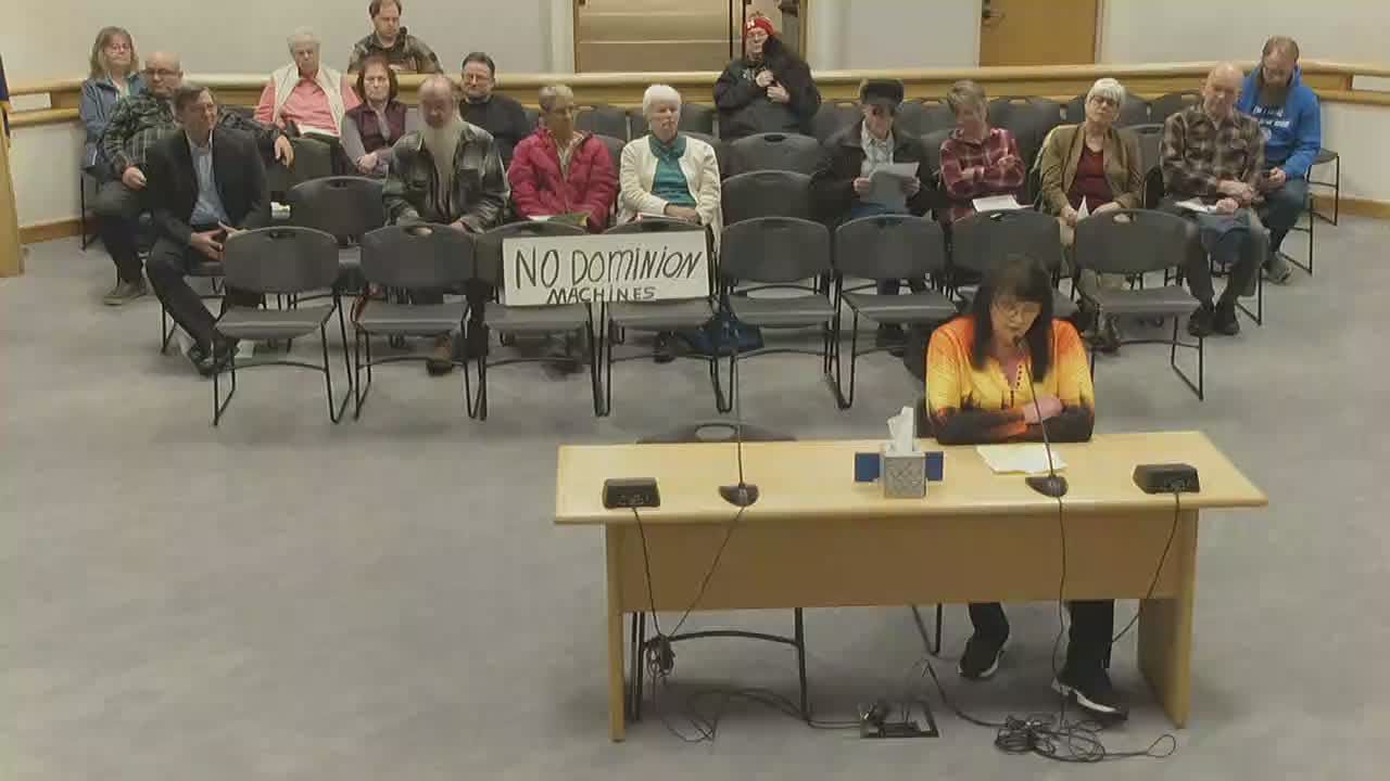 Fairbanks resident Kelly Nash campaigns against Dominion voting machine contract renewal