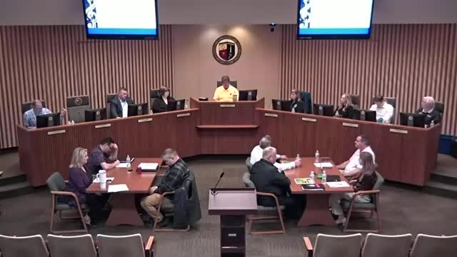Trustee critiques candidate's financial claims during Village Board meeting