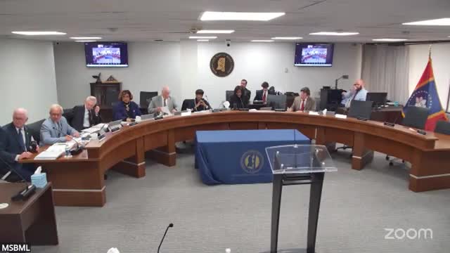 Priscilla Razer collaborates with examining committee during July board meeting