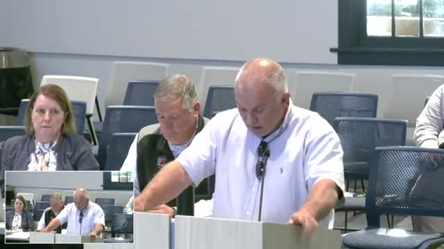 Resident questions DEI positions and communications salaries during Winchester school board public comment