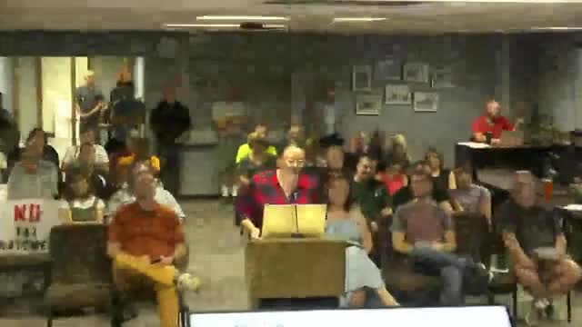 Residents of Lincoln Avenue North protest new sidewalk mandate at city council meeting
