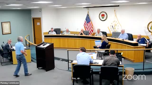Gerard Levine addresses stormwater issues due to proposed development at Wisteria Drive