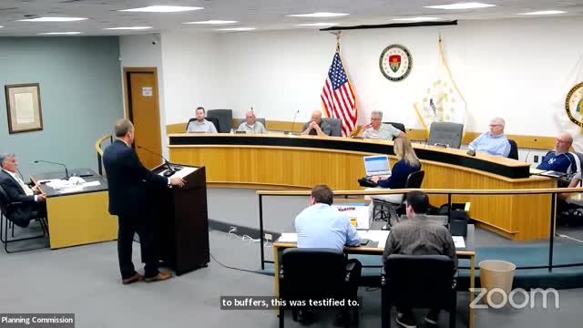 Engineer Sam Hemingway addresses development setbacks at community meeting