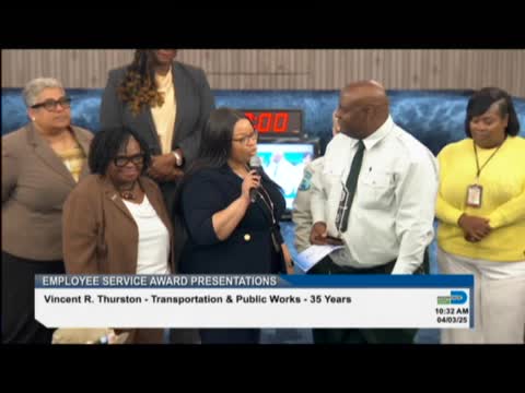 Regina Bode honors Vincent Thurston for safe driving excellence in Miami Dade County